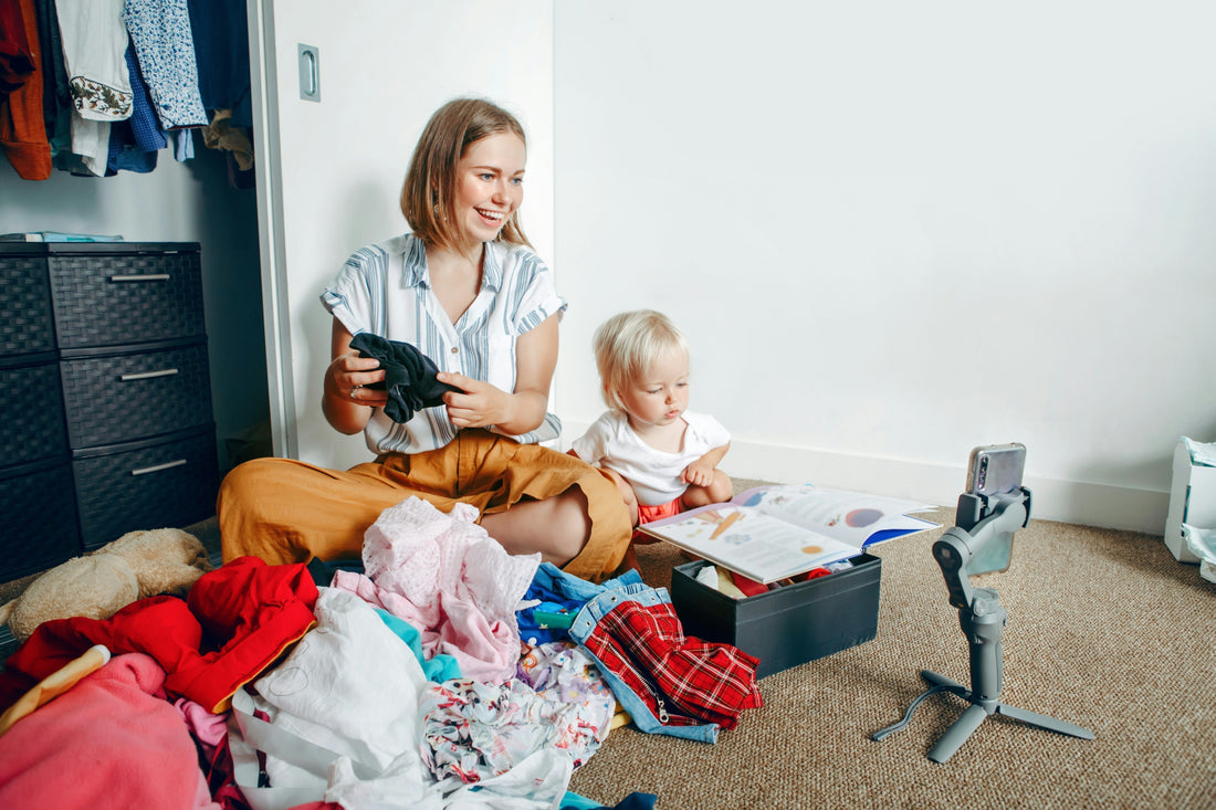 Folded pile of premium pre-loved children's clothing ready to be sold through a sellback program 
